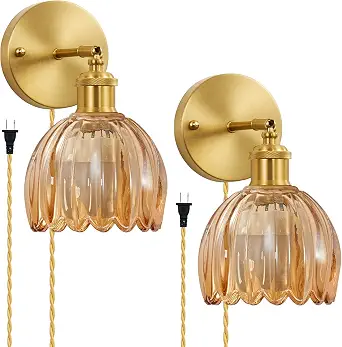 Amber wall sconces for warm cocoon bedroom lighting